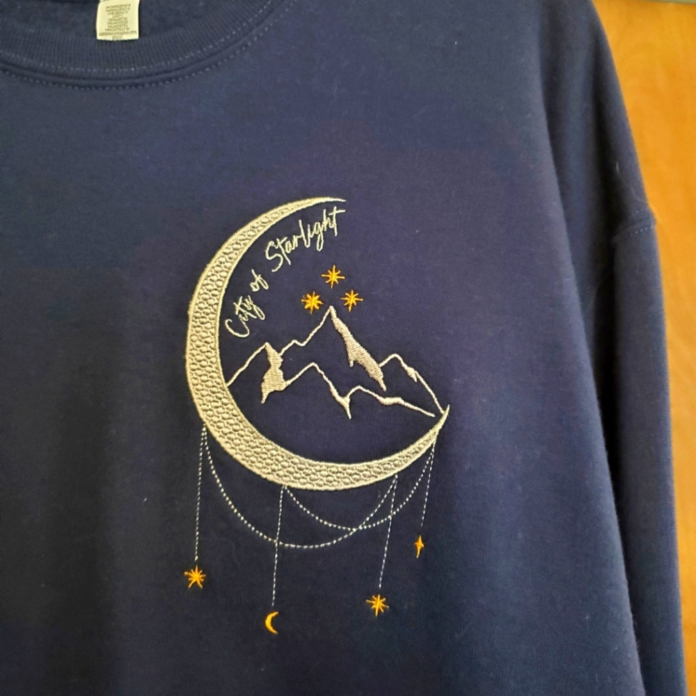 Enchanted Oddities VELARIS City of Starlight sweatshirt.